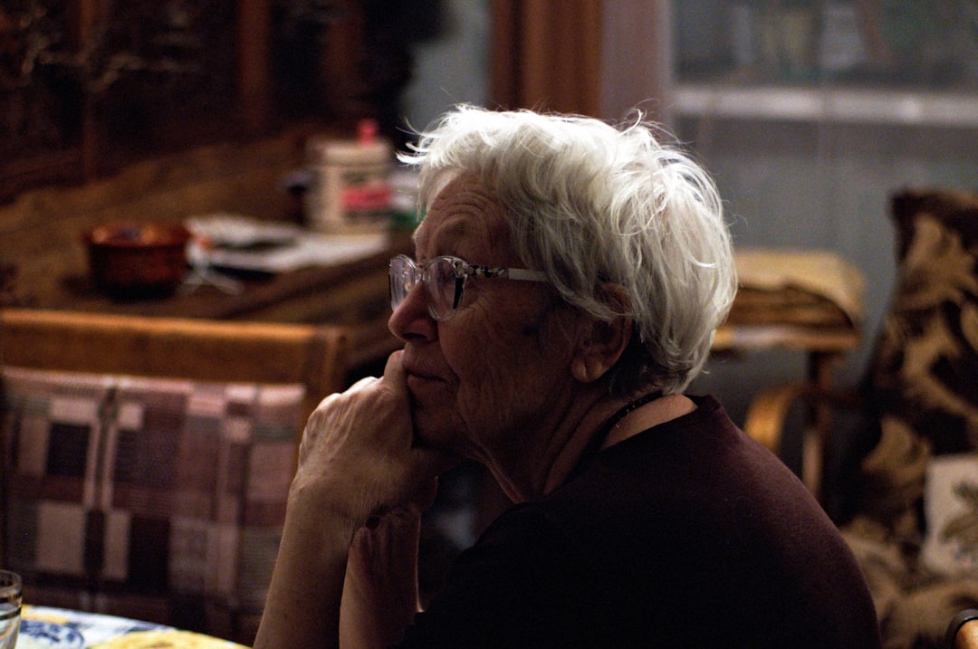 Woman wearing glasses with a thoughtful expression