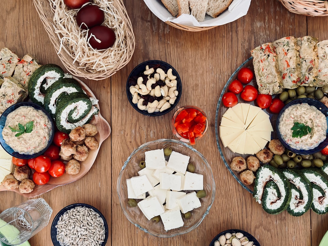 a wooden table topped with plates of food